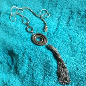 Long silver necklace with tassel